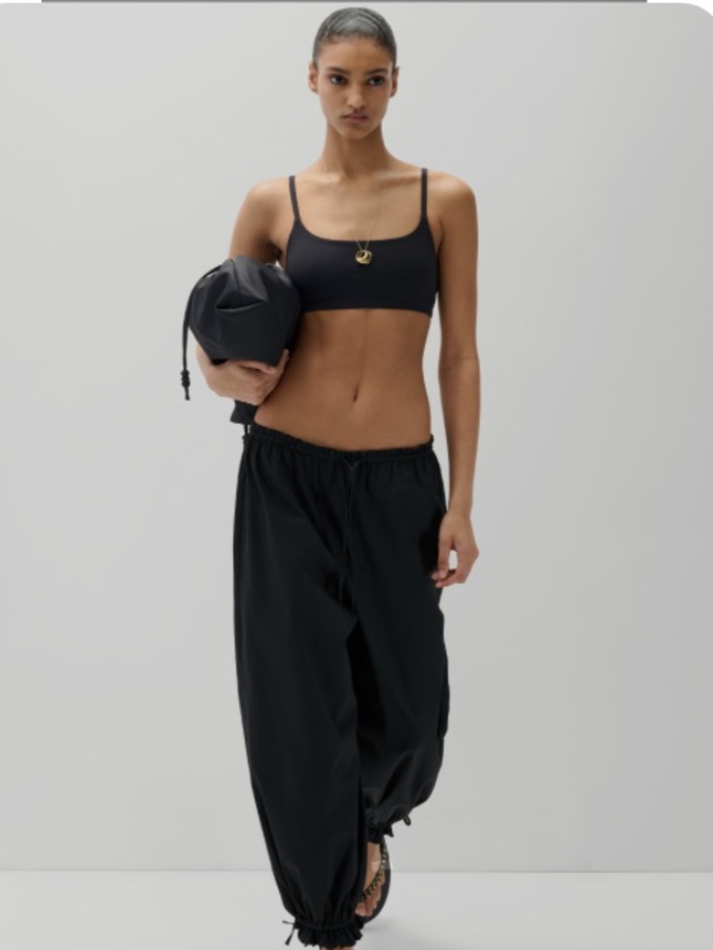 Wilfred Aritzia Black Off-Shoulder top with matching balloon pant.